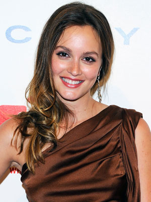 Leighton wearing a satin dress